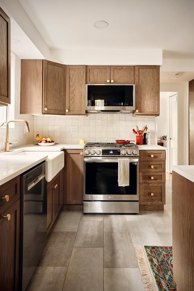 Wood cabinets and stainless steel appliances in a kitchen.