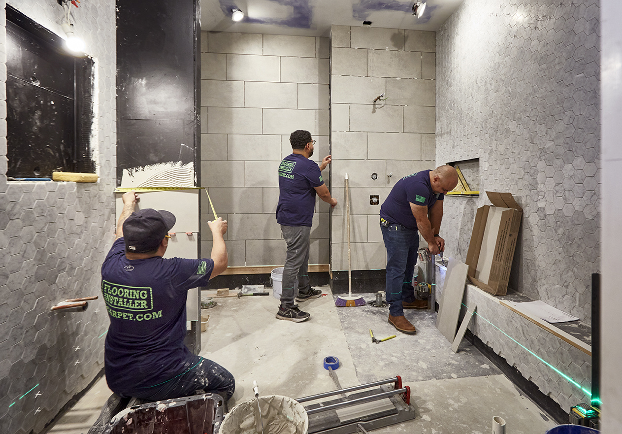 General contractor and crew working on a bathroom remodel in New York City