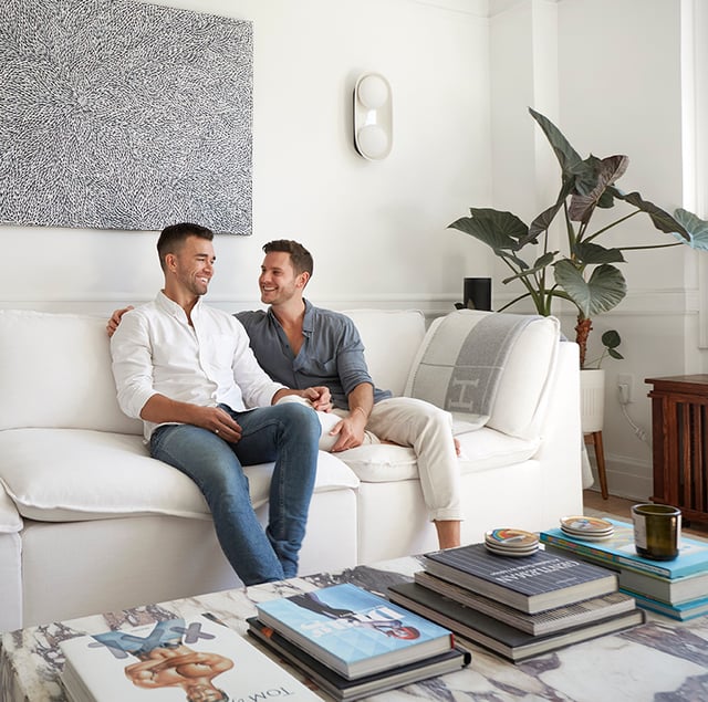 Couple sitting in the living room of their newly remodeled space