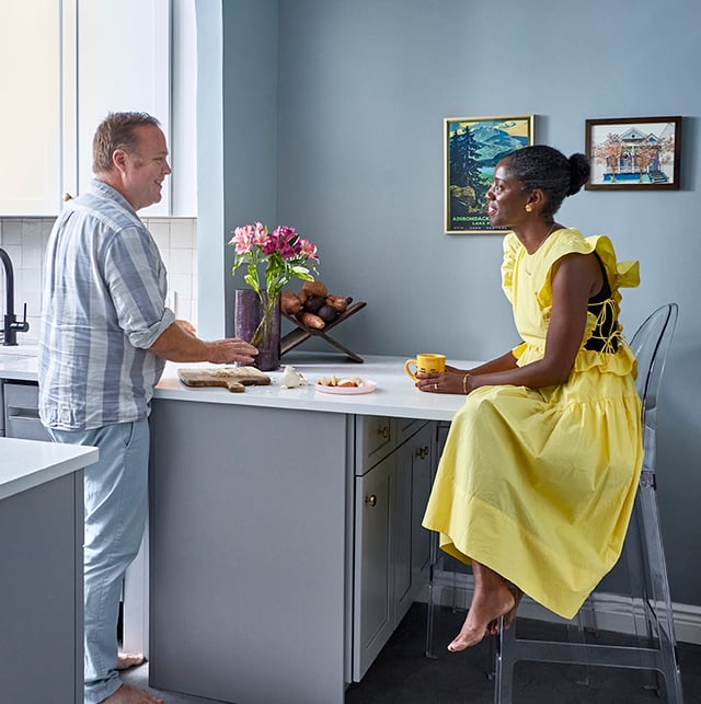 Couple in their newly painted and renovated kitchen