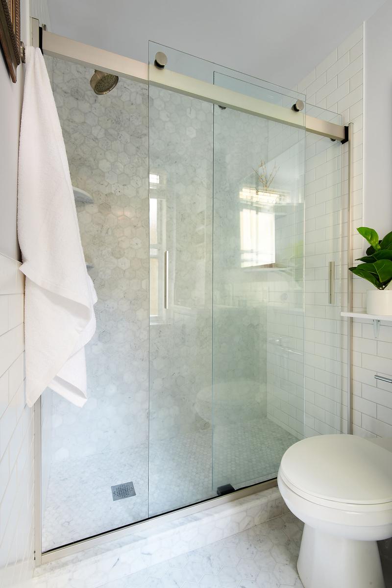 white tiled shower different shaped tiles