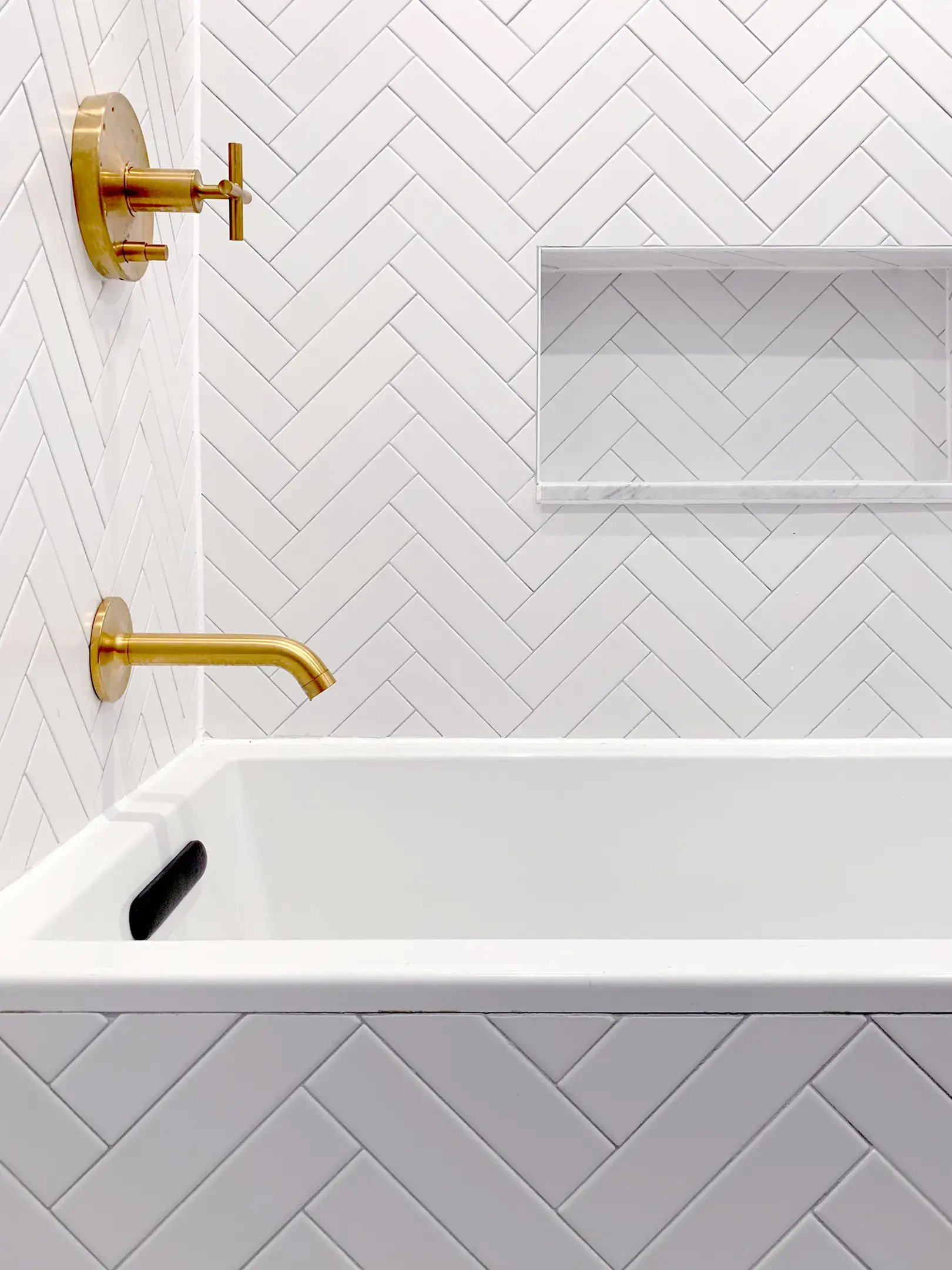 Herringbone subway tile shower white