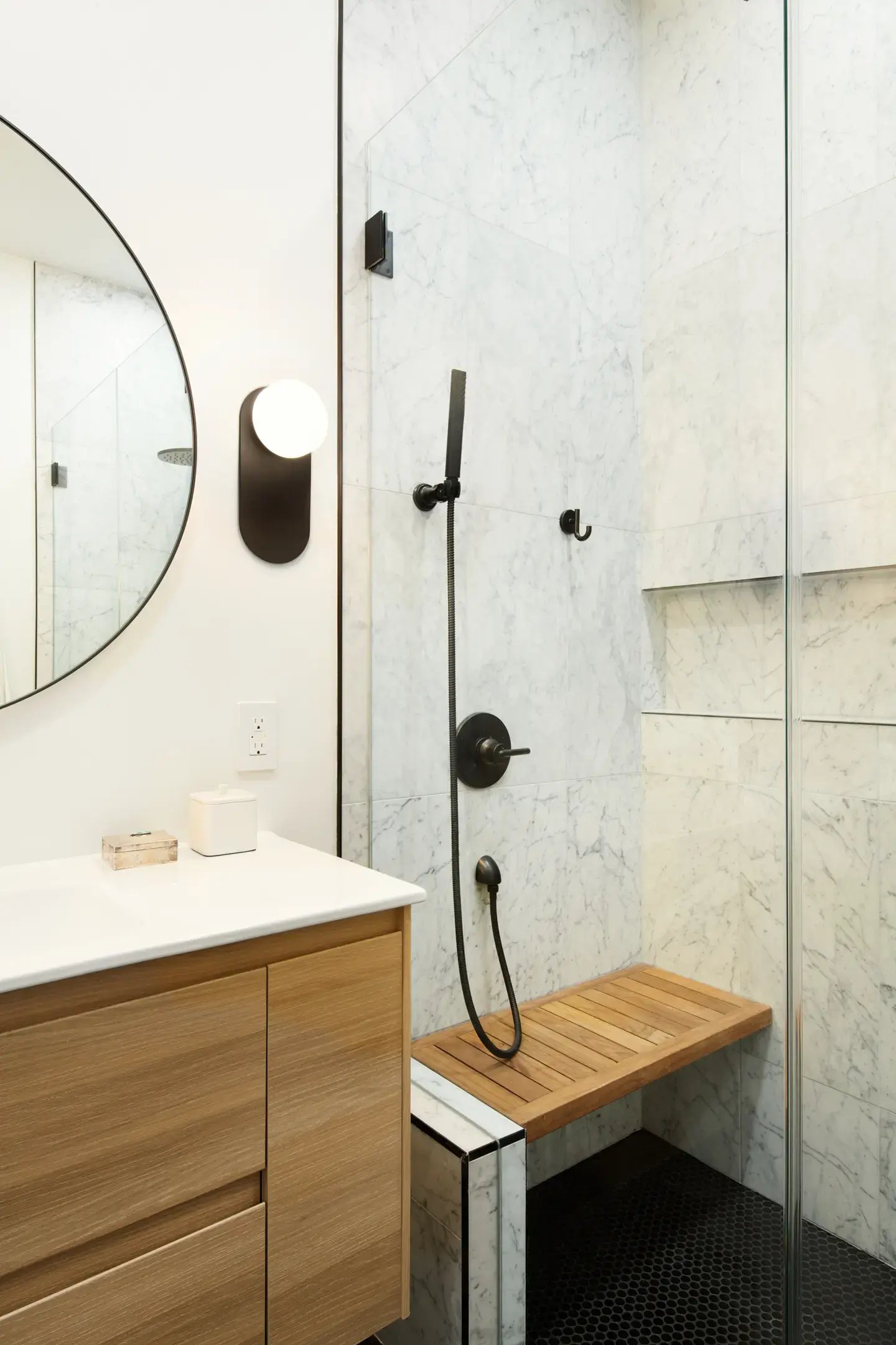 Frameless shower with marble walls