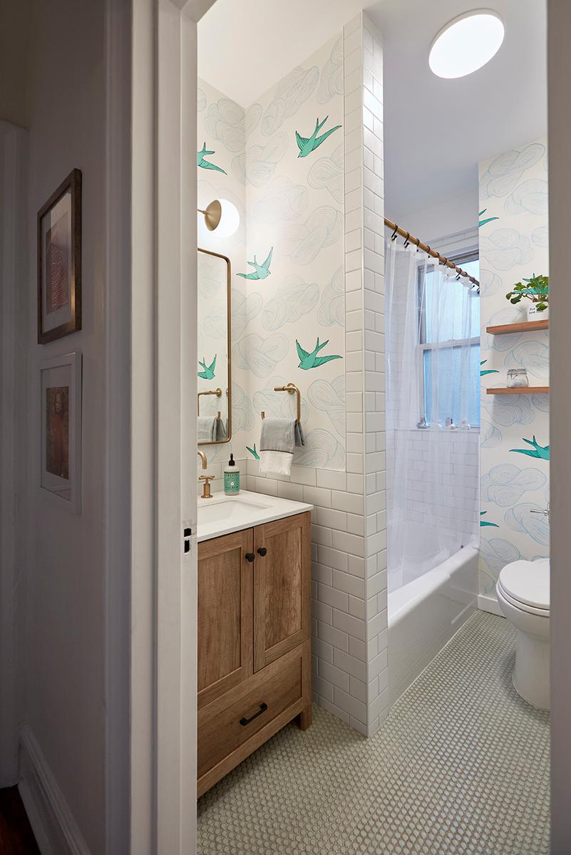 White bathroom with window in shower