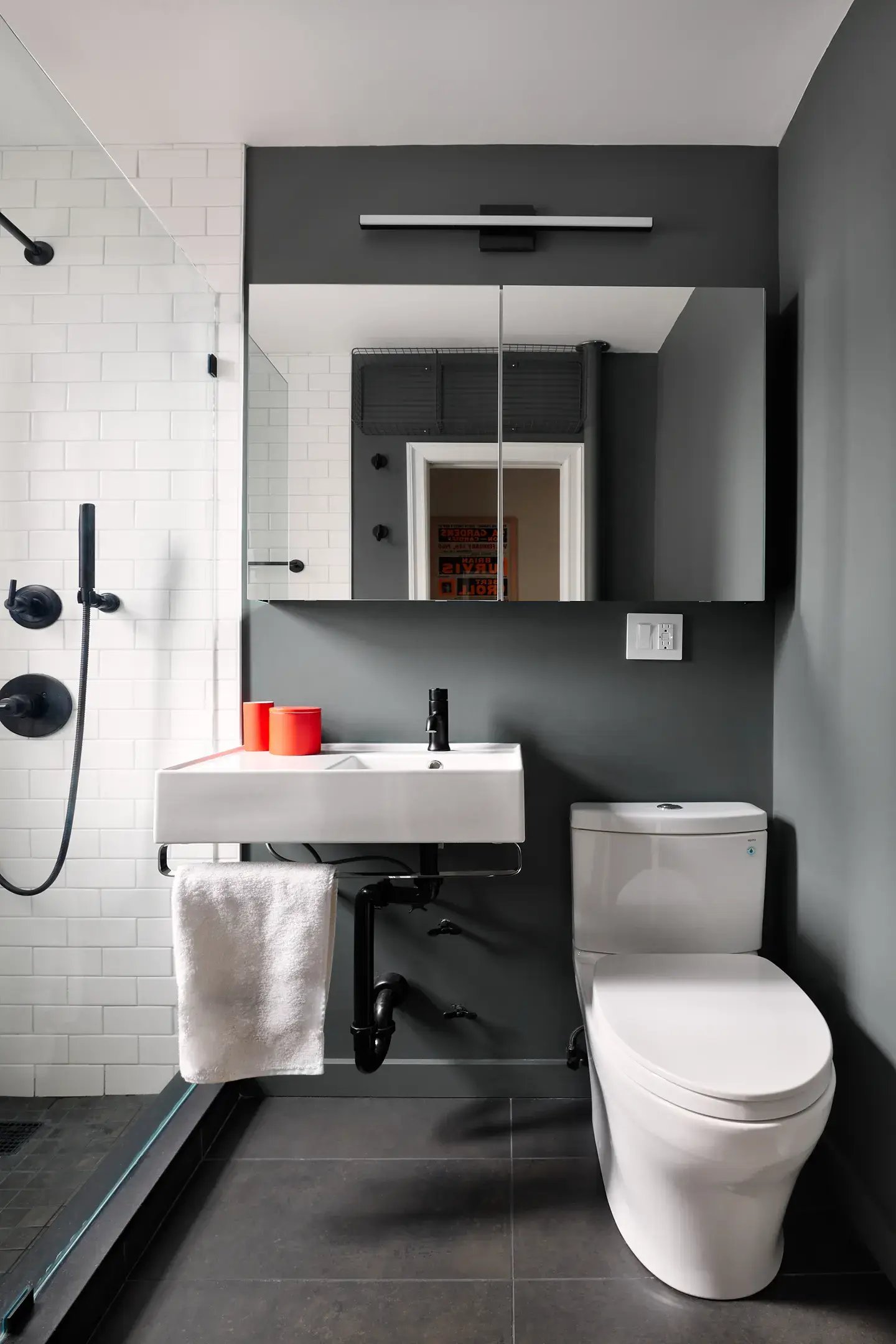 Black and white bathroom with pop of red