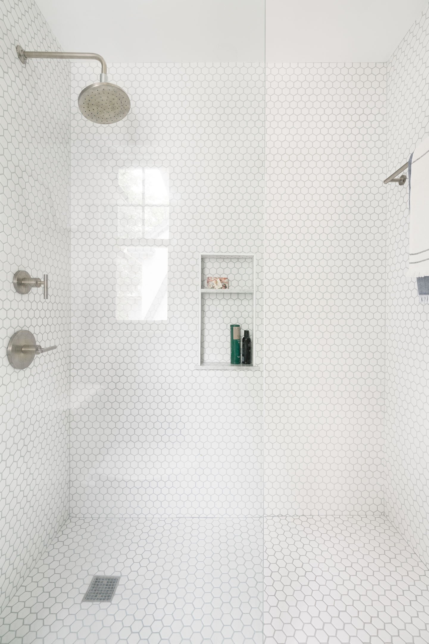 white tiled shower hexagon tiles