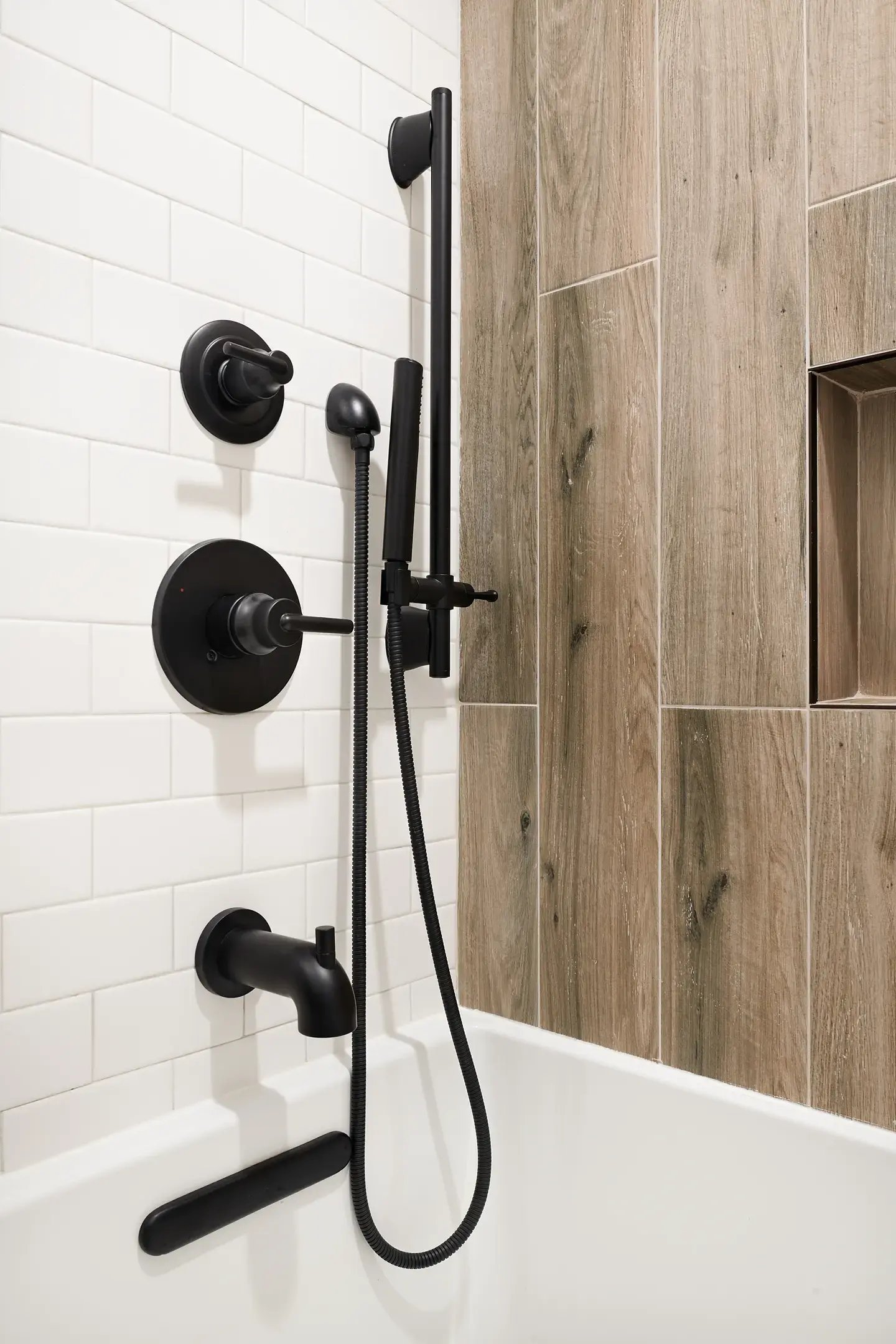 Bathroom with subway and wood-like tiles