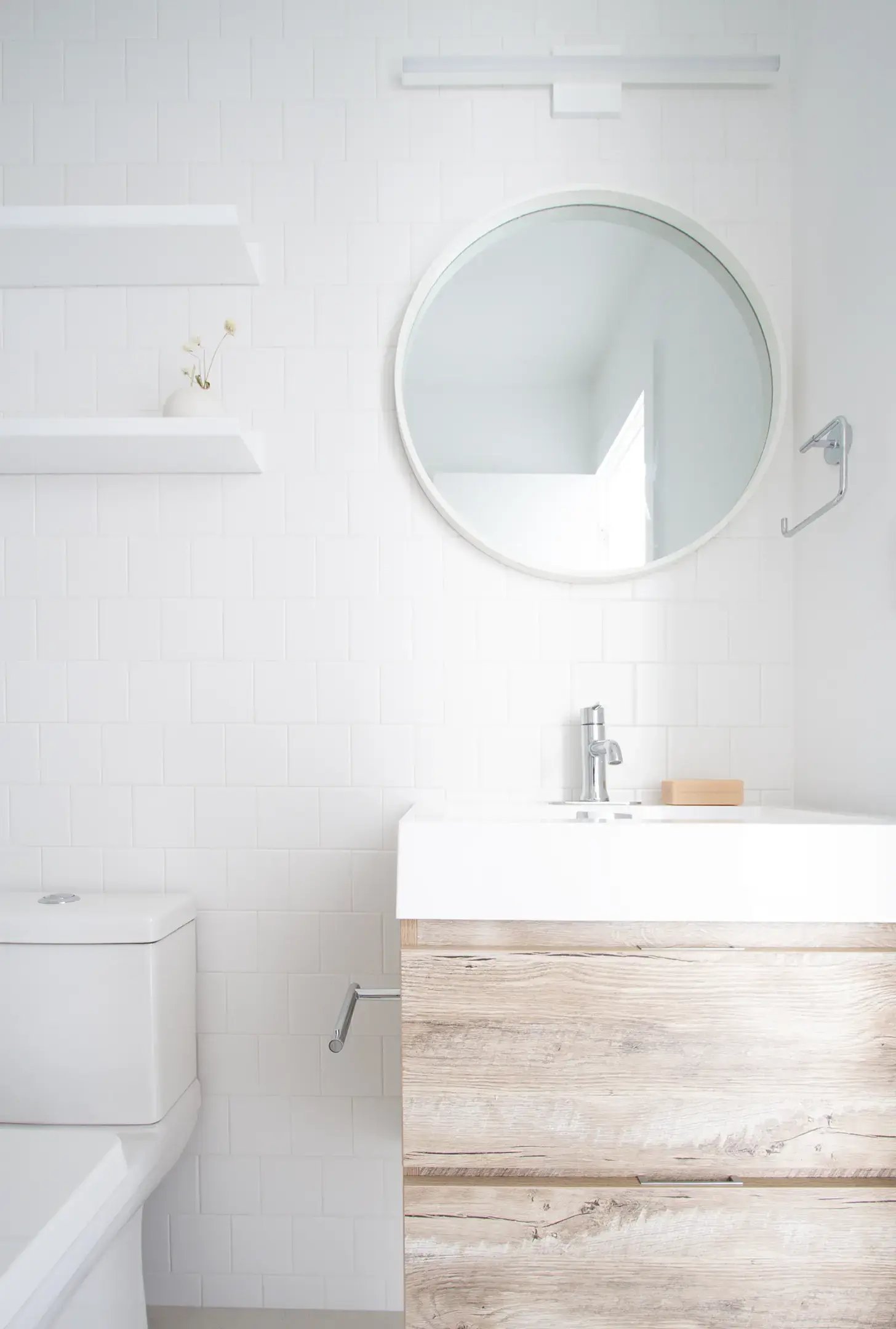 White bathroom with wood vanity