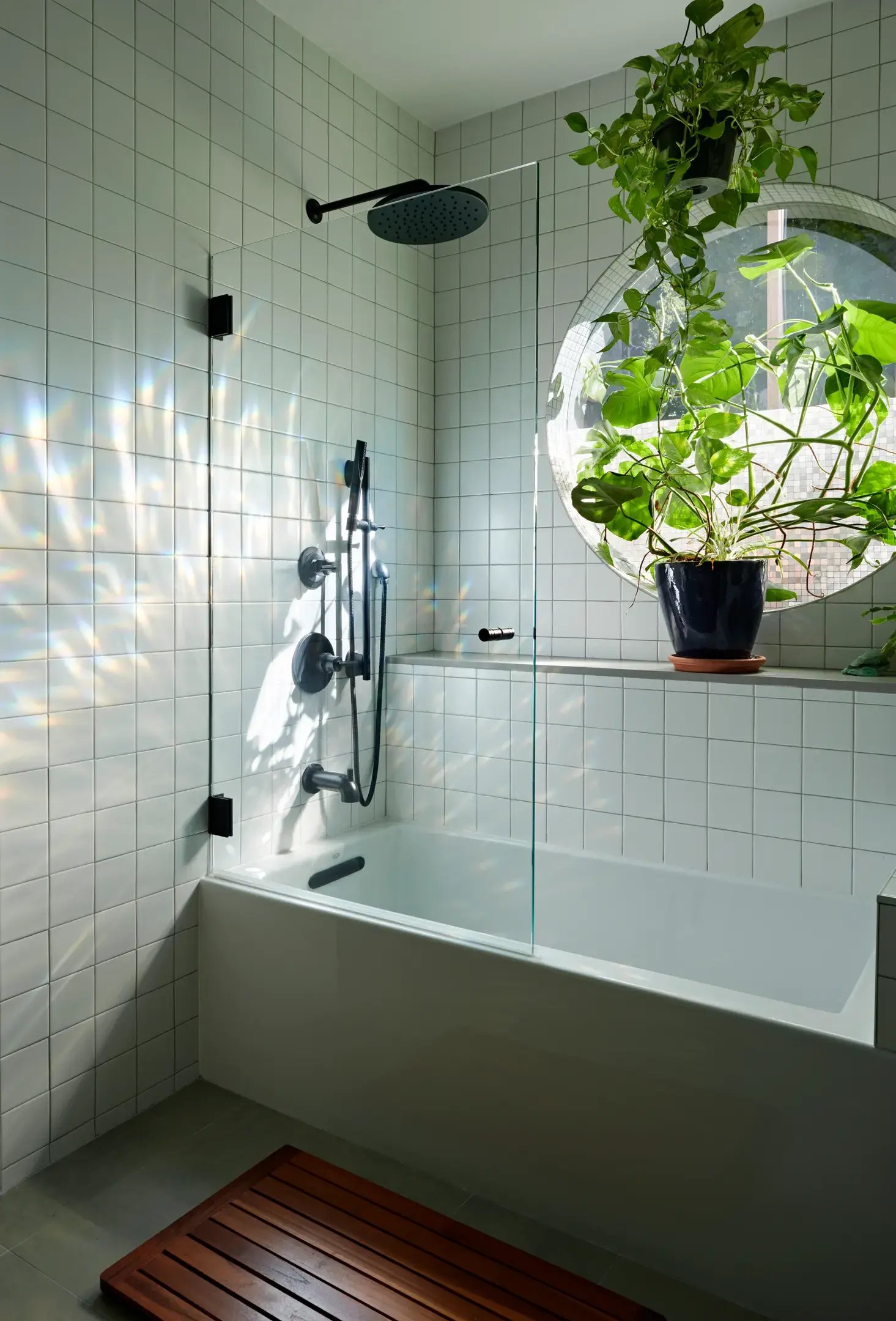 Circular window above tub with plant