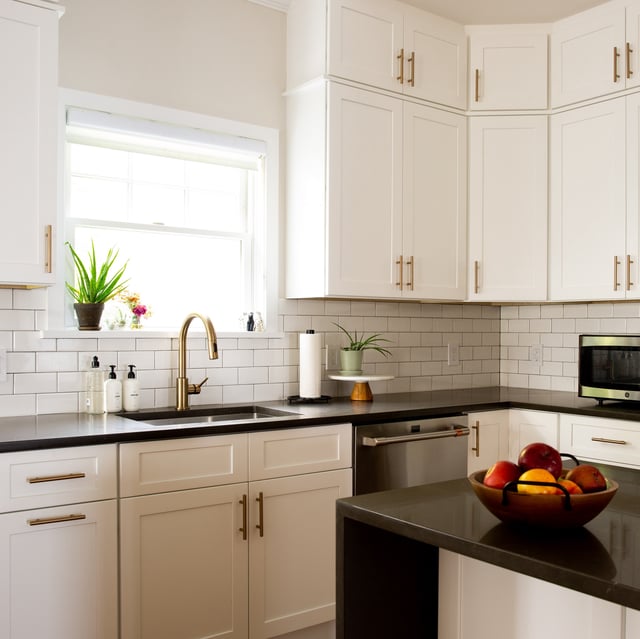 Classic white kitchen remodel with black countertops in Westchester County, New York