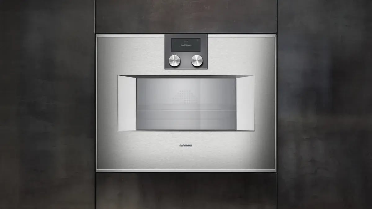 Modern stainless Gaggenau wall oven with digital display.