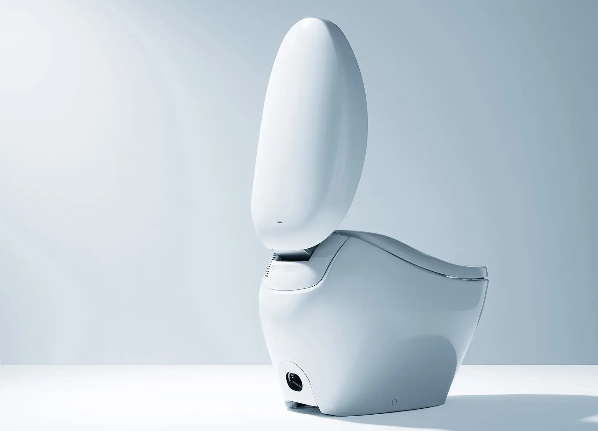 A modern, white, bidet toilet with the lid open.