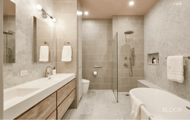 Recently remodeled bathroom natural stone and wood