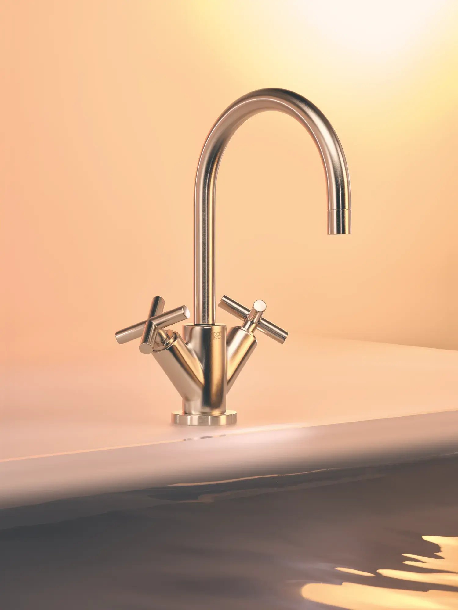 A champagne-colored kitchen or bathroom faucet.
