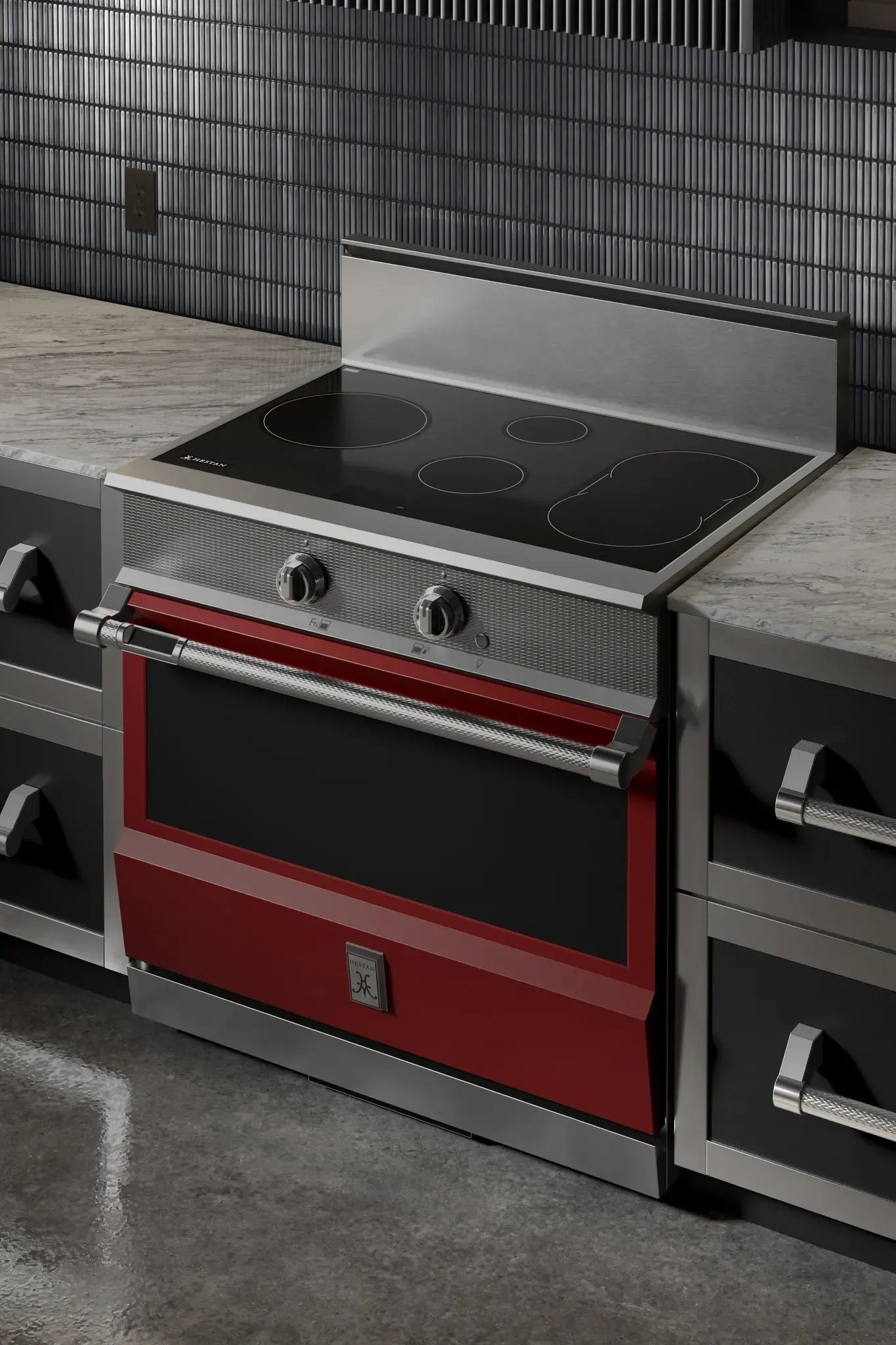Bold red Hestan induction range with a textured steel handle.